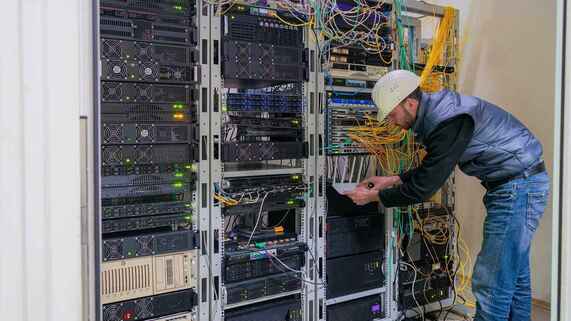 engineer working in network room